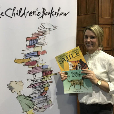 Catherine with her books and The Children's Bookshow sign