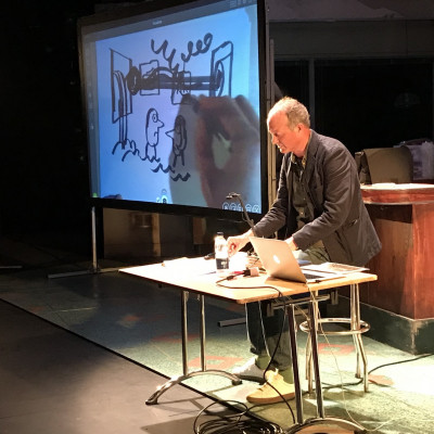 Jon drawing on stage at the New Wolsey theatre in Ipswich
