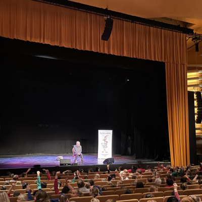 Michael Rosen on stage at Peterborough New Theatre 2023