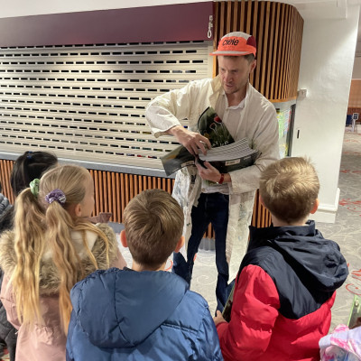 Sydney Smith handing out copies of his book *My Baba's Garden* to all the children who came to the event.