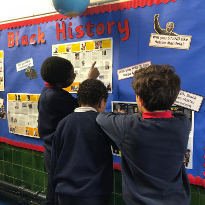 Children from Ravenstone Primary with their black history display