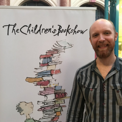 Alexis poses with our lovely Children's Bookshow sign!