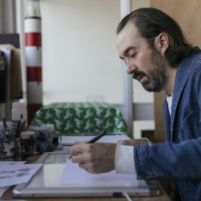 Benji Davies drawing in his studio