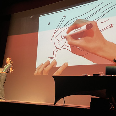 Kate Wakeling performed poems while Elina Braslina drew pictures to illustrate them