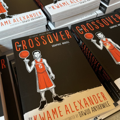 We gave every child who came to the performance a free copy of Kwame Alexander's book *The Crossover*