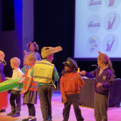 Children dancing on stage at Mariesa and Rebecca's show