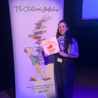 Marta Altés with the Bookshow banner in Milton Keynes