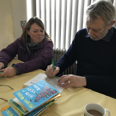 Michael signing books for a big fan!