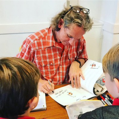 Neal signs books after the show