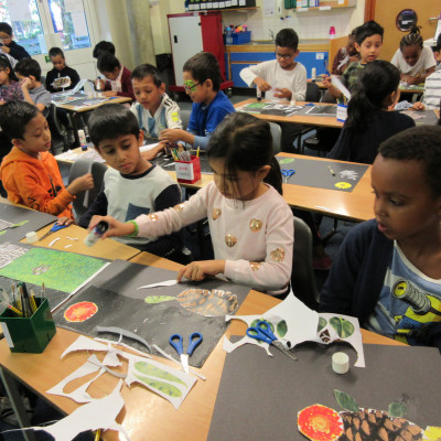 Children from Blue Gates Field Juniors making collages during Neal Layton's workshop