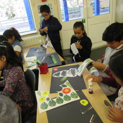 Children from Blue Gates Field Juniors making collages during Neal Layton's workshop