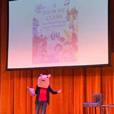 Rachel ends her performance by putting on her hamster head, and reading her poem about the school hamster!