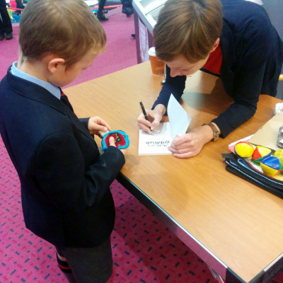 Rachel Rooney signing books at a Children's Bookshow event in Warwick in 2014