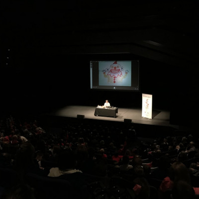 Satoshi drawing clowns for the audience at Warwick Arts Centre