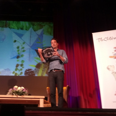 Actor Samuel John reads *The Real Boat* to the children