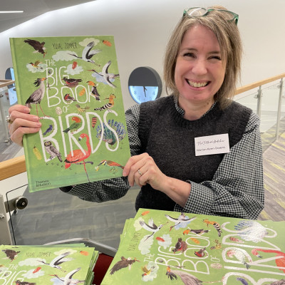 Children's Bookshow team member, Marian, with Yuval Zommer's beautiful book - we gave one to every child attending!