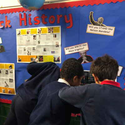 Children from Ravenstone Primary with their black history display