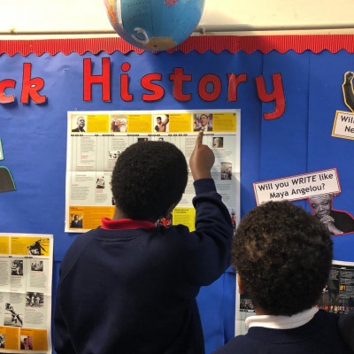 Children from Ravenstone Primary with their black history display