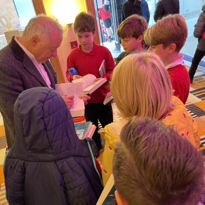 Frank Cottrell-Boyce meets children after his performance in Peterborough